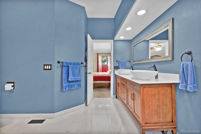 ensuite bathroom with recessed lighting, ensuite bath, and vanity