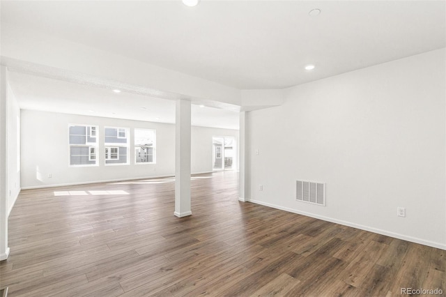 interior space with recessed lighting, visible vents, baseboards, and wood finished floors