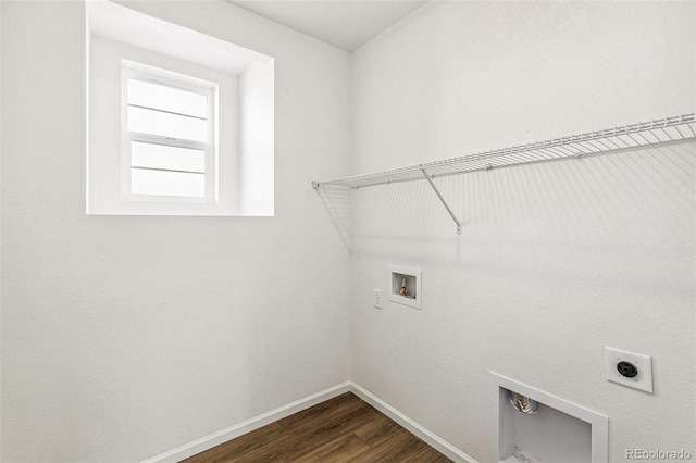 laundry room with laundry area, baseboards, dark wood-style floors, hookup for a washing machine, and electric dryer hookup