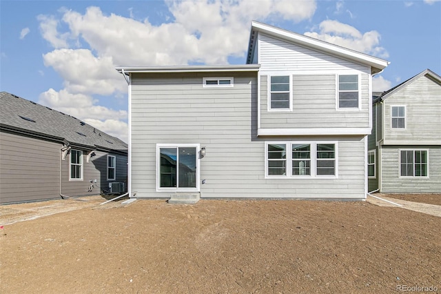 back of property with central AC unit