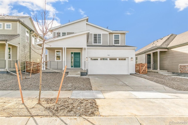 view of front of property featuring covered porch, driveway, and an attached garage