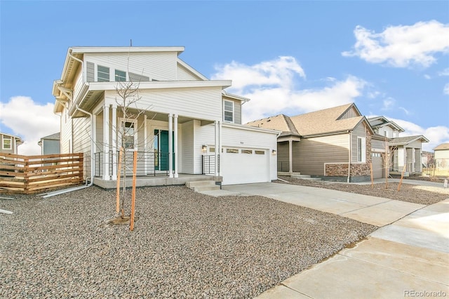 view of front facade featuring driveway, an attached garage, fence, and a porch