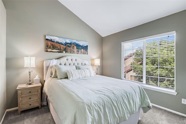 bedroom with carpet, vaulted ceiling, and baseboards