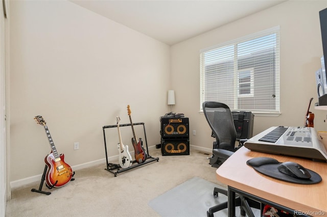 carpeted office featuring baseboards