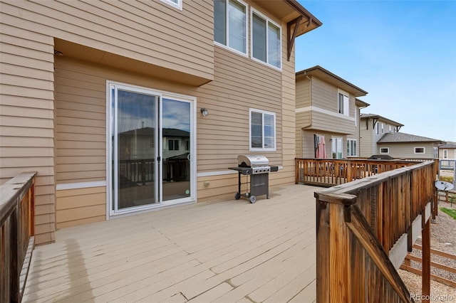 wooden terrace with a grill