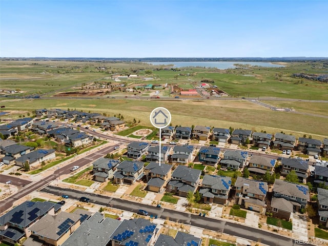 aerial view featuring a water view and a residential view
