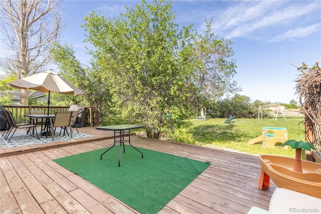 4374 E Peakview Cir, Centennial, CO 80121 - wooden deck with a playground, outdoor dining area, and a yard