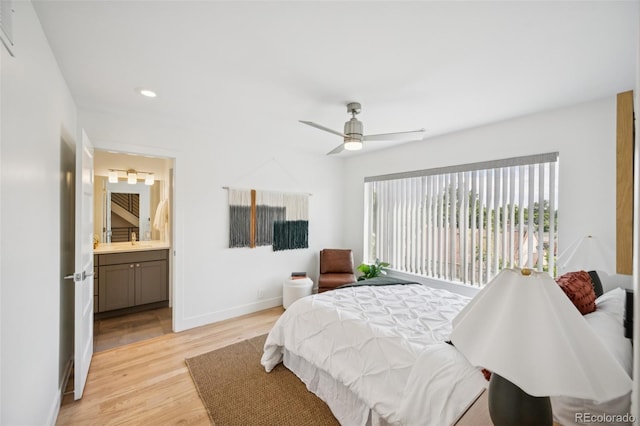 4922 Lowell Blvd Unit 3, Denver, CO 80221 - bedroom featuring light wood-style flooring, recessed lighting, ensuite bath, and a ceiling fan