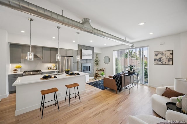 4922 Lowell Blvd Unit 3, Denver, CO 80221 - kitchen with open floor plan, stainless steel appliances, gray cabinetry, and recessed lighting