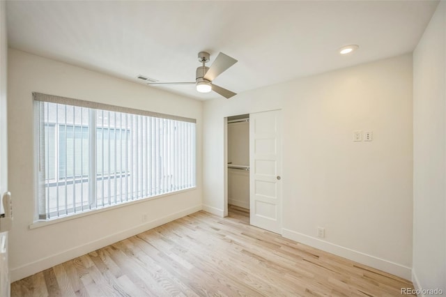4922 Lowell Blvd Unit 3, Denver, CO 80221 - unfurnished bedroom featuring multiple windows, wood finished floors, a closet, ceiling fan, and recessed lighting