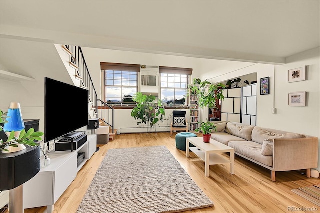 2351 Federal Blvd Unit 401, Denver, CO 80211 - living area with stairway, light wood-style flooring, and baseboard heating
