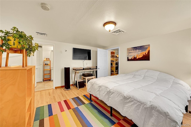 2351 Federal Blvd Unit 401, Denver, CO 80211 - bedroom featuring light wood-style flooring and baseboards