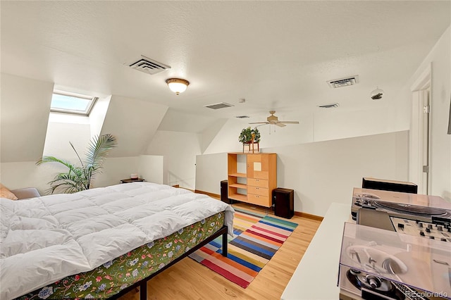 2351 Federal Blvd Unit 401, Denver, CO 80211 - bedroom with light wood-type flooring and vaulted ceiling