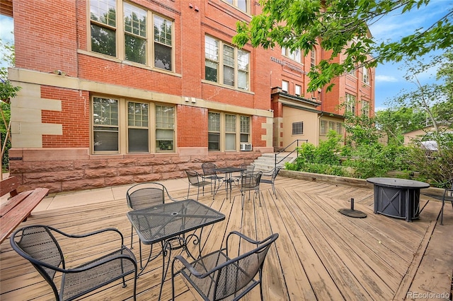 2351 Federal Blvd Unit 401, Denver, CO 80211 - wooden terrace with outdoor dining space and cooling unit