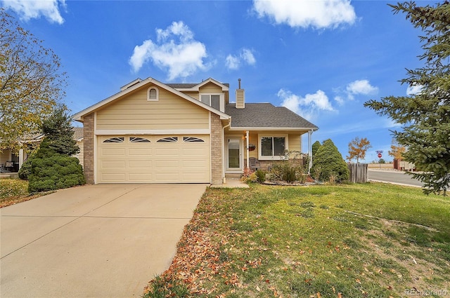 view of front of house with a front yard and a garage