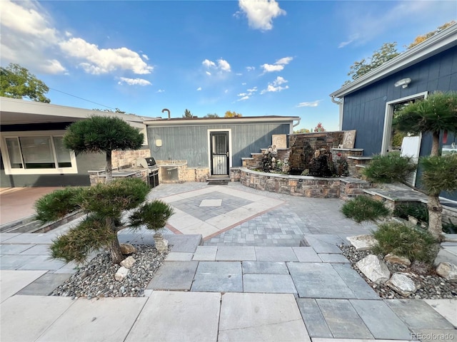 doorway to property with a patio area