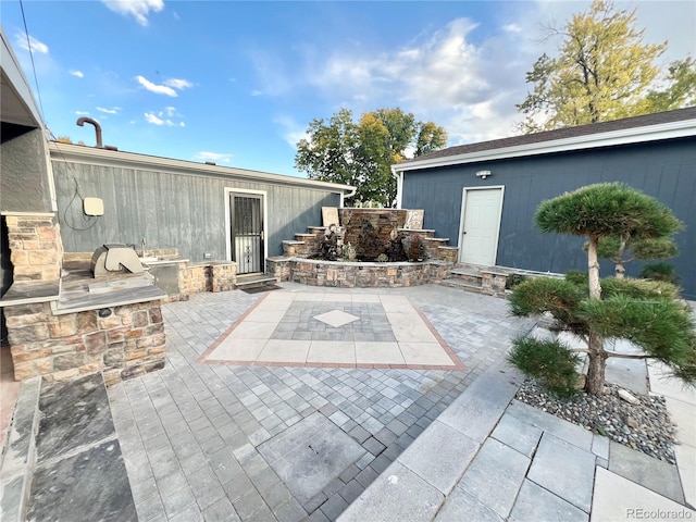 view of patio / terrace featuring exterior kitchen