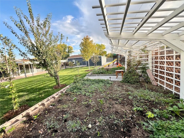 view of yard featuring a playground and a pergola