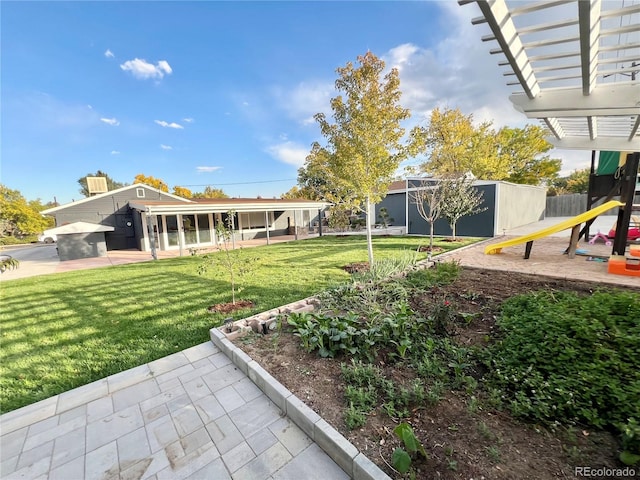 view of yard with a playground and a pergola