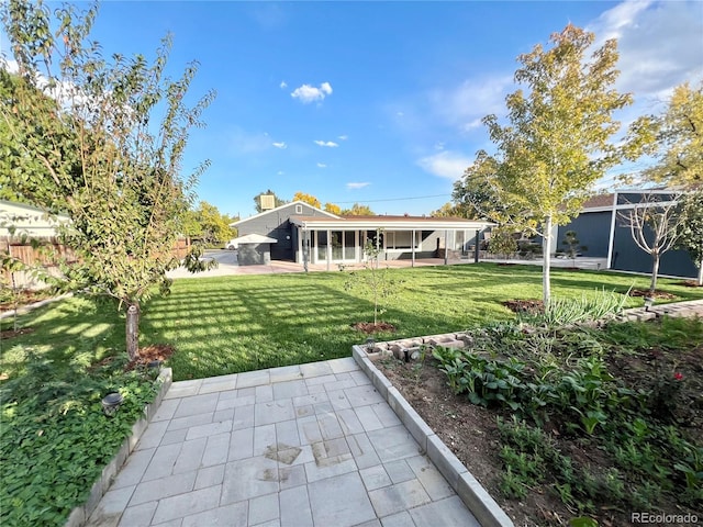 exterior space featuring a yard and a patio area