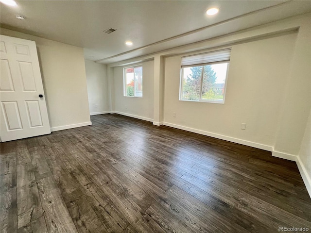 empty room featuring dark wood-type flooring