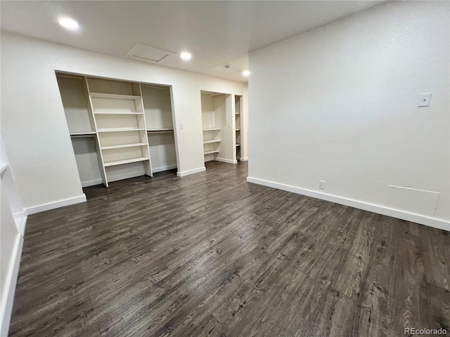 unfurnished bedroom with dark hardwood / wood-style flooring