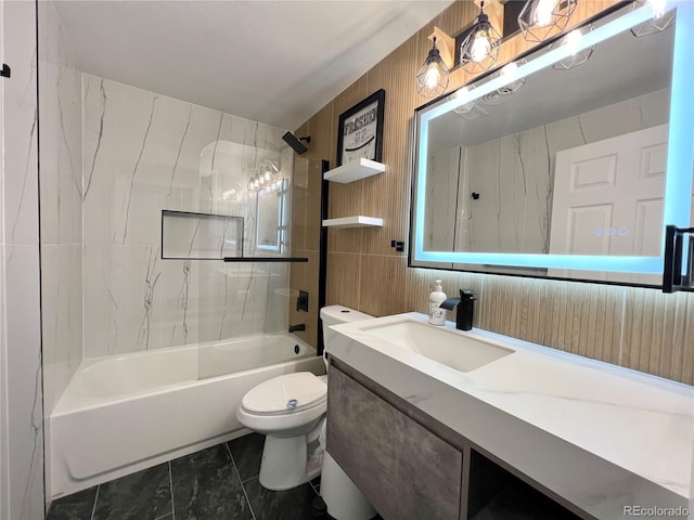 full bathroom with tiled shower / bath, vanity, and toilet