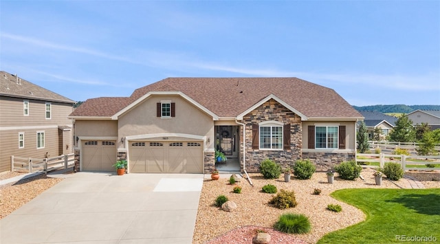 5615 Clover Ridge Cir, Castle Rock, CO 80104 - view of front facade with stone siding, driveway, stucco siding, and an attached garage