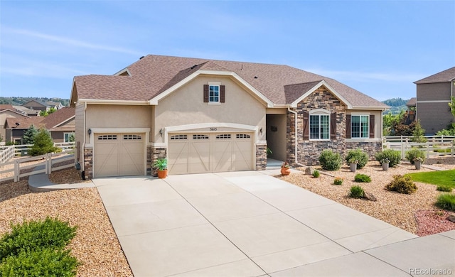 5615 Clover Ridge Cir, Castle Rock, CO 80104 - view of front of property with stone siding, stucco siding, and concrete driveway