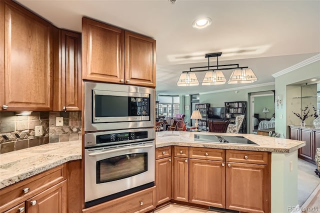 kitchen featuring tasteful backsplash, crown molding, brown cabinets, a peninsula, and black electric cooktop