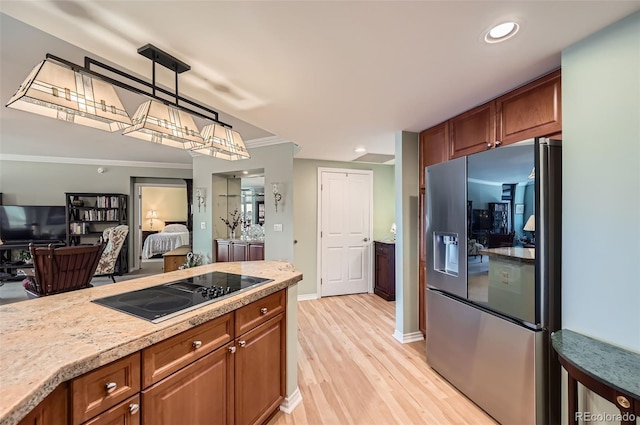 kitchen featuring light countertops, black electric cooktop, stainless steel fridge with ice dispenser, and brown cabinets