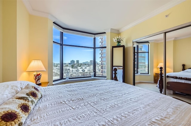 bedroom featuring a city view, crown molding, multiple windows, and carpet