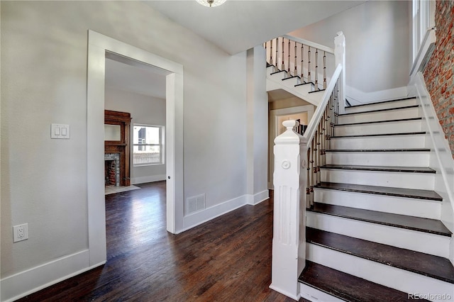 stairway featuring hardwood / wood-style floors