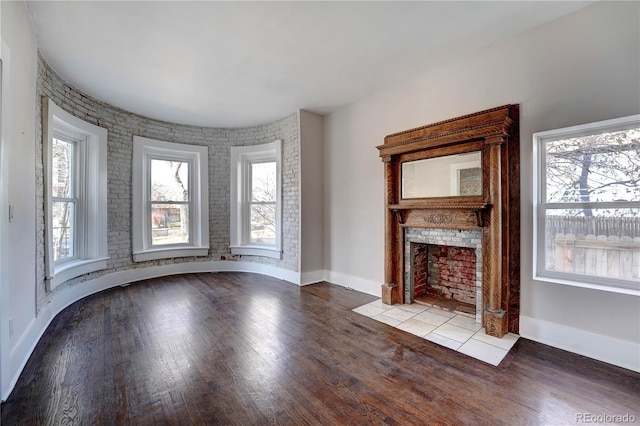 unfurnished living room with light wood-type flooring