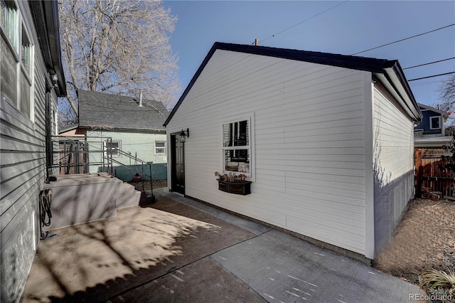 view of side of home with a patio area