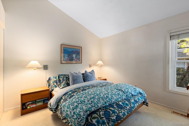 1470 S Quebec Way Unit 245, Denver, CO 80231 - carpeted bedroom featuring vaulted ceiling and baseboards