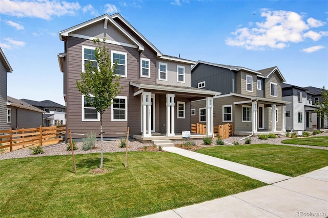 view of front of house featuring a porch and a front lawn