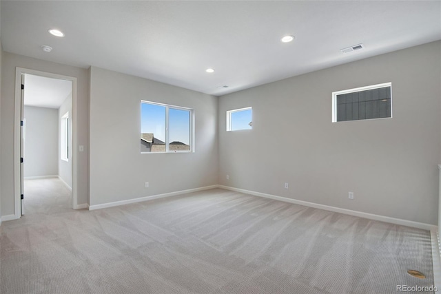 empty room with light colored carpet