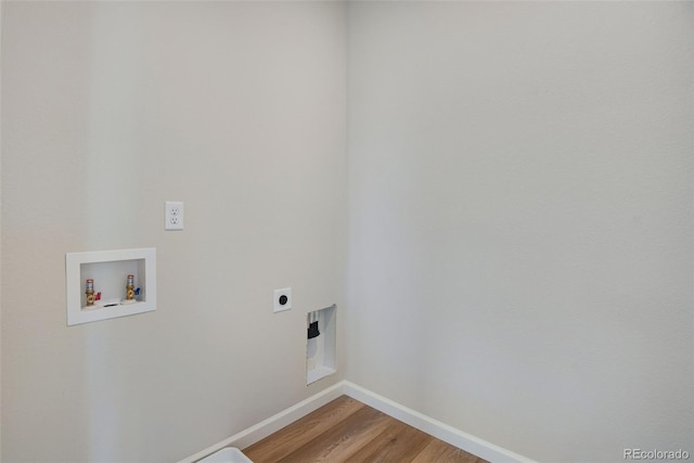 washroom featuring hookup for a washing machine, hardwood / wood-style floors, and hookup for an electric dryer