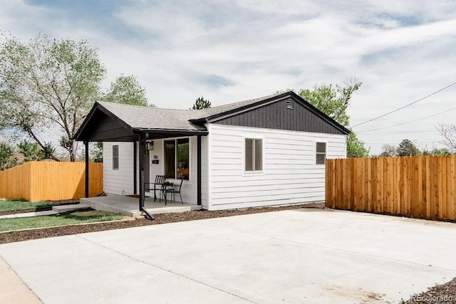 930 S Lowell Blvd, Denver, CO 80219 - rear view of property featuring roof with shingles