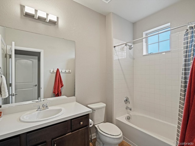 bathroom with vanity, toilet, and shower / tub combo with curtain