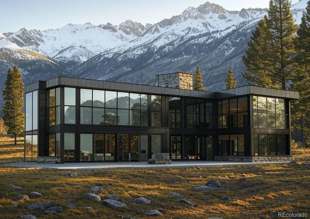 rear view of property with a mountain view