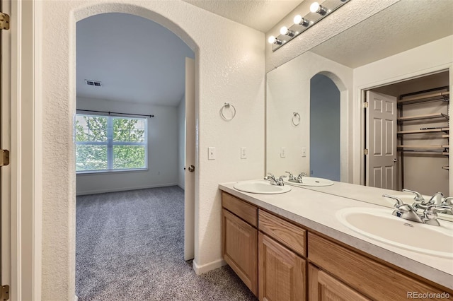 3375 Boulder Cir Unit 204, Broomfield, CO 80023 - full bath featuring double vanity and a textured wall