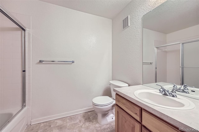 3375 Boulder Cir Unit 204, Broomfield, CO 80023 - bathroom with a textured ceiling, vanity, a textured wall, baseboards, and toilet