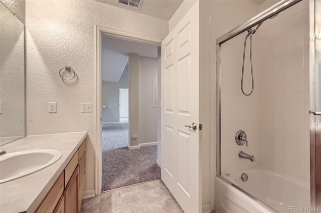 3375 Boulder Cir Unit 204, Broomfield, CO 80023 - full bath with vanity, a textured wall, and bathtub / shower combination