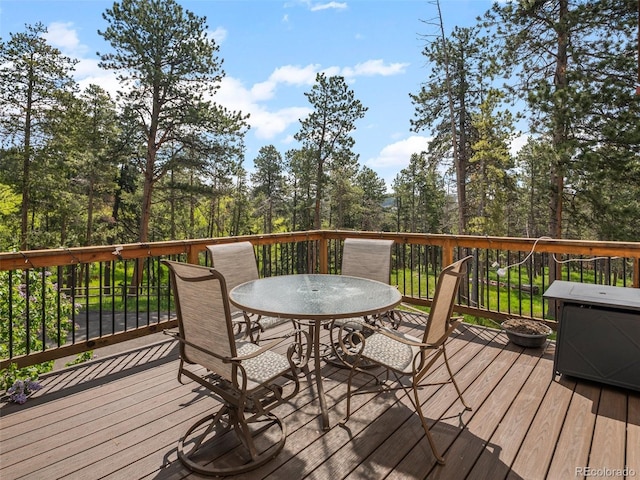 23076 Oehlmann Park Rd, Conifer, CO 80433 - wooden terrace with outdoor dining area