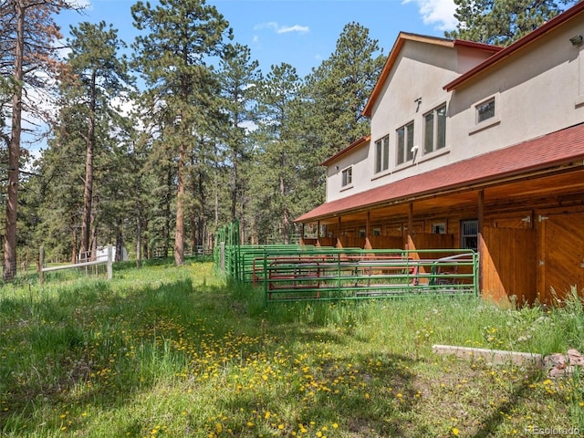 23076 Oehlmann Park Rd, Conifer, CO 80433 - view of yard with an exterior structure and an outbuilding