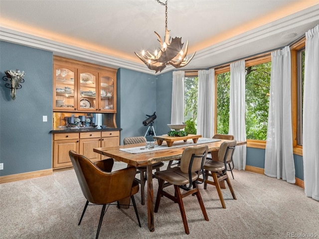 23076 Oehlmann Park Rd, Conifer, CO 80433 - dining space featuring a chandelier and light colored carpet