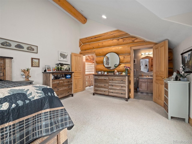 23076 Oehlmann Park Rd, Conifer, CO 80433 - bedroom featuring log walls, high vaulted ceiling, light colored carpet, beam ceiling, and ensuite bath