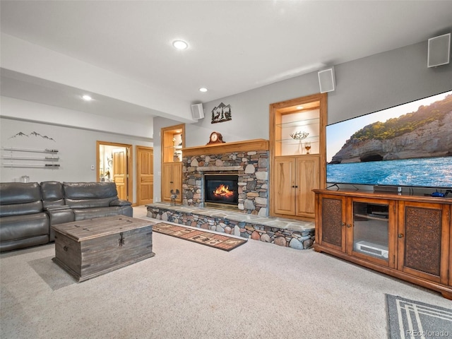 23076 Oehlmann Park Rd, Conifer, CO 80433 - living room featuring carpet floors, a stone fireplace, and recessed lighting